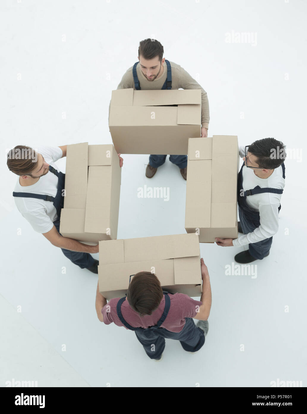 Delivery men with cardboard boxes on white background Stock Photo Alamy