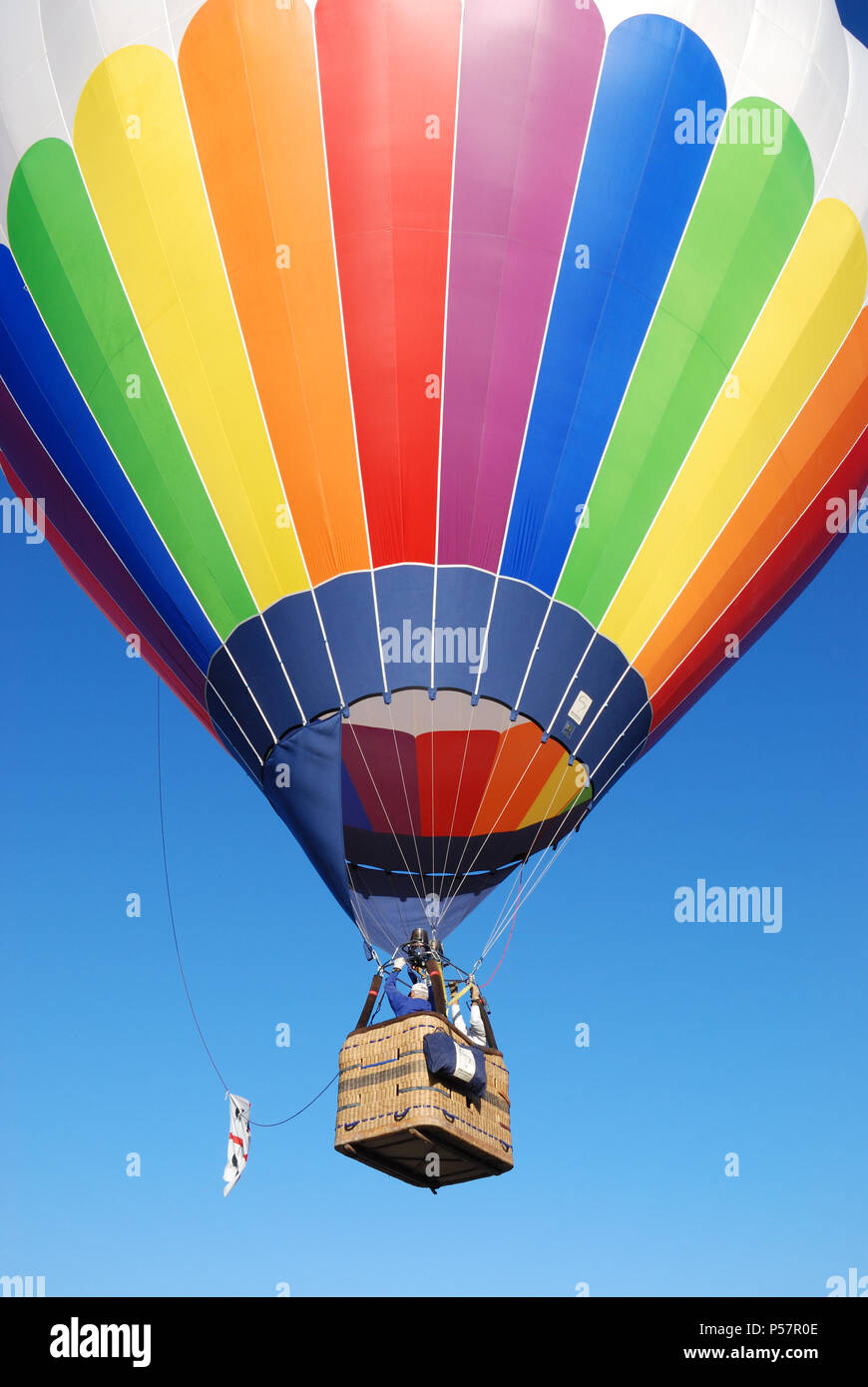 Colorful hot air balloon in a blue sky Stock Photo - Alamy