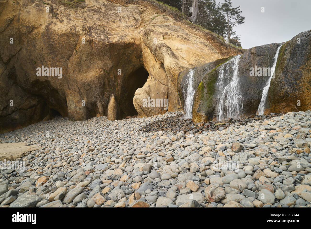 Hug Point, Oregon, United States The caves and waterfall in Hug Point State Recreation Site. Stock Photo