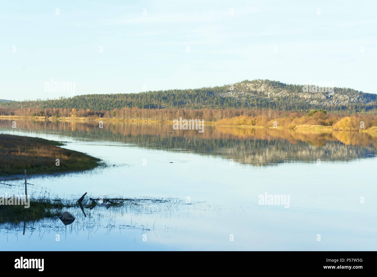Torniojoki river and Luppio berget in Sweden in autumnal hues seen from Ylitornio Finland Stock Photo