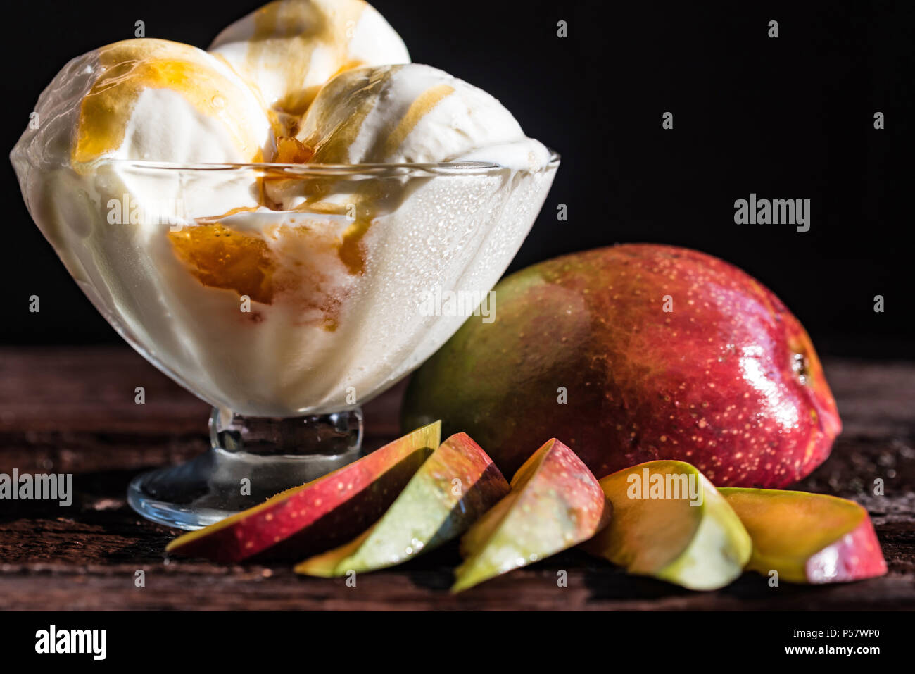 Caramel Sauce Ice Cream And Fresh Mango Fruit Stock Photo Alamy