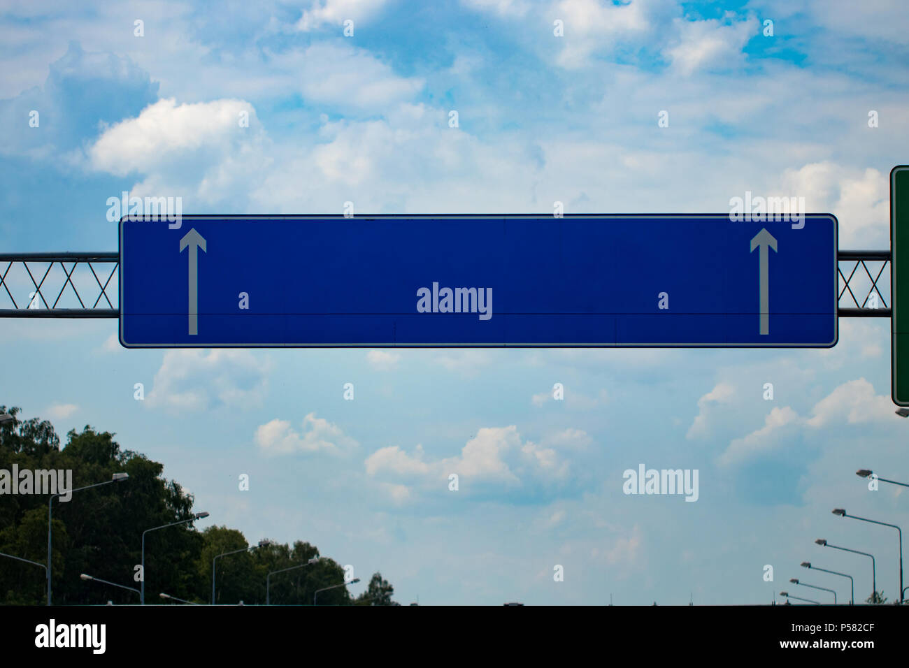 Big blank highway road sign with gradient blue sky Stock Photo - Alamy
