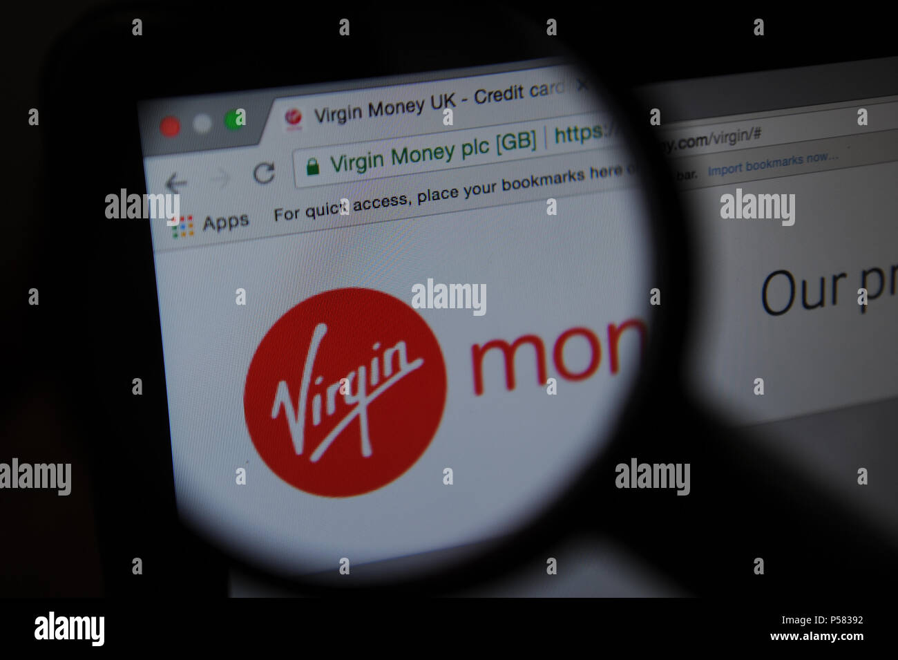 The Virgin Money Website Seen Through A Magnifying Glass Sto!   ck Photo - the virgin money website seen through a magnifying glass