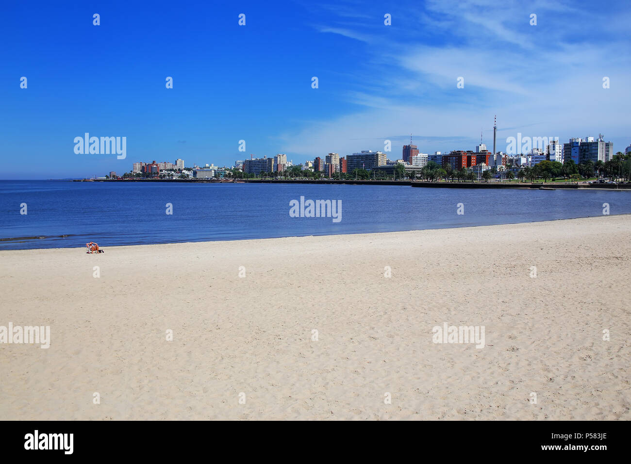 Sandy beach along the bank of the Rio de la Plata in Montevideo, Uruguay. Montevideo is the capital and the largest city of Uruguay Stock Photo