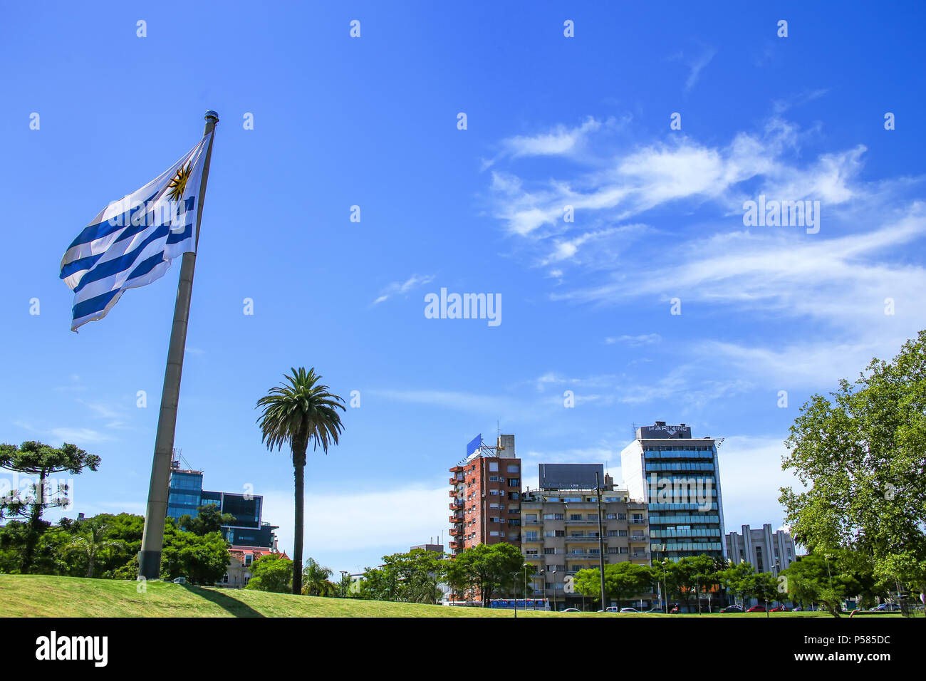 National flag of Uruguay flying in Tres Cruces district of Montevideo, Uruguay. Montevideo is the capital and largest city of Uruguay. Stock Photo