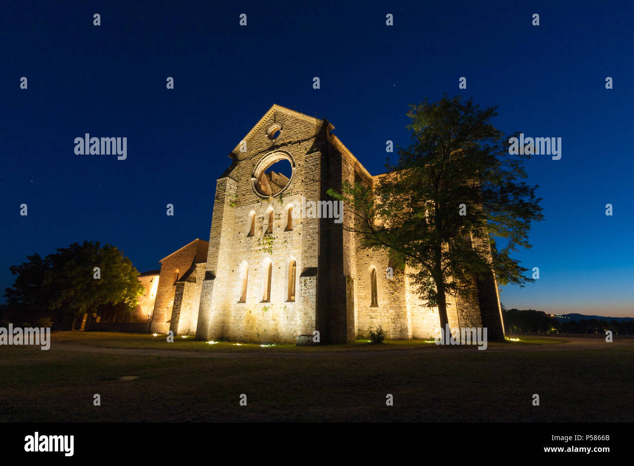 Siena, Italy - August 21: The San Galgano roofless Cistercian abbey in Chiusdino, Tuscany, at sunset in summer Stock Photo