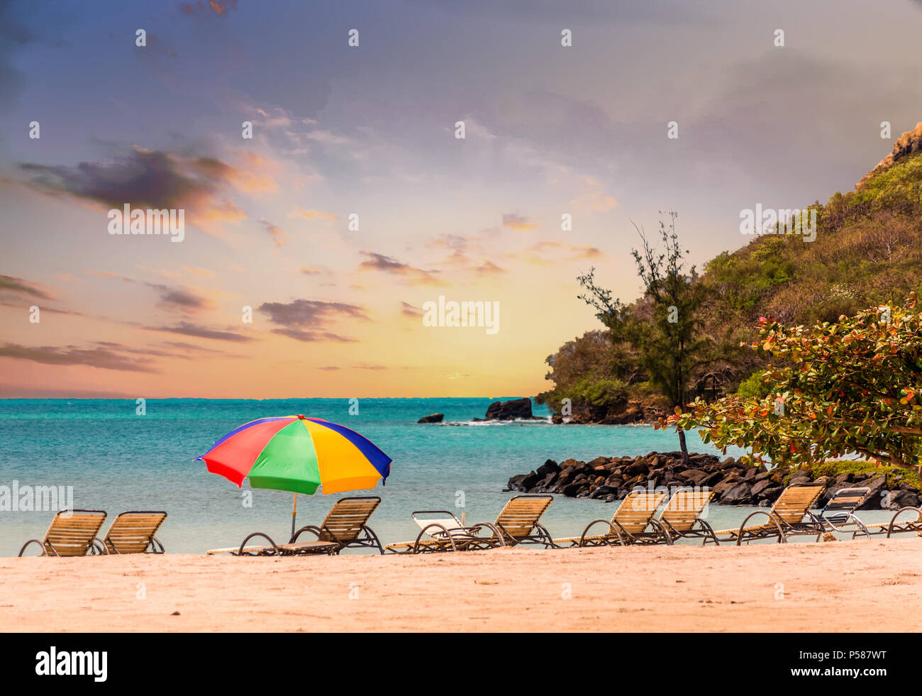 Chaise Lounges and Beach Umbrella Stock Photo