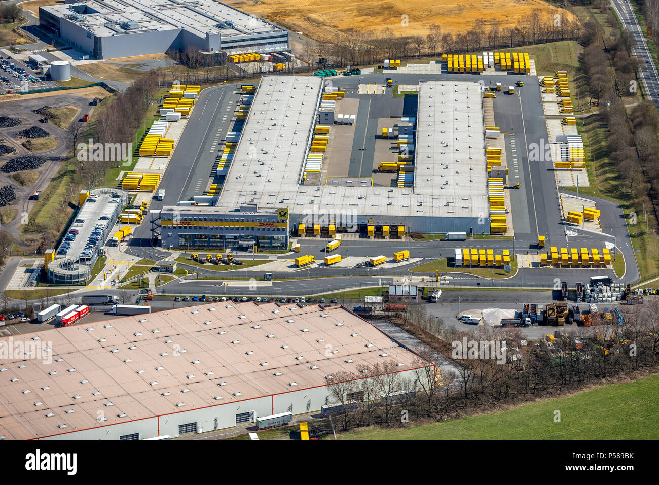 Commercial area Dorsten-Ost, DHL freight center Dorsten, shipping service with trucks, logistics center in Dorsten in NRW. Dorsten, Ruhr area, North R Stock Photo