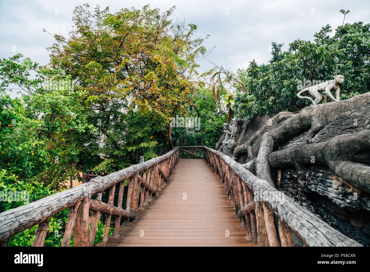 Bangkok, Thailand - November 8, 2017 : Green forest and wooden bridge at Dusit Zoo Stock Photo