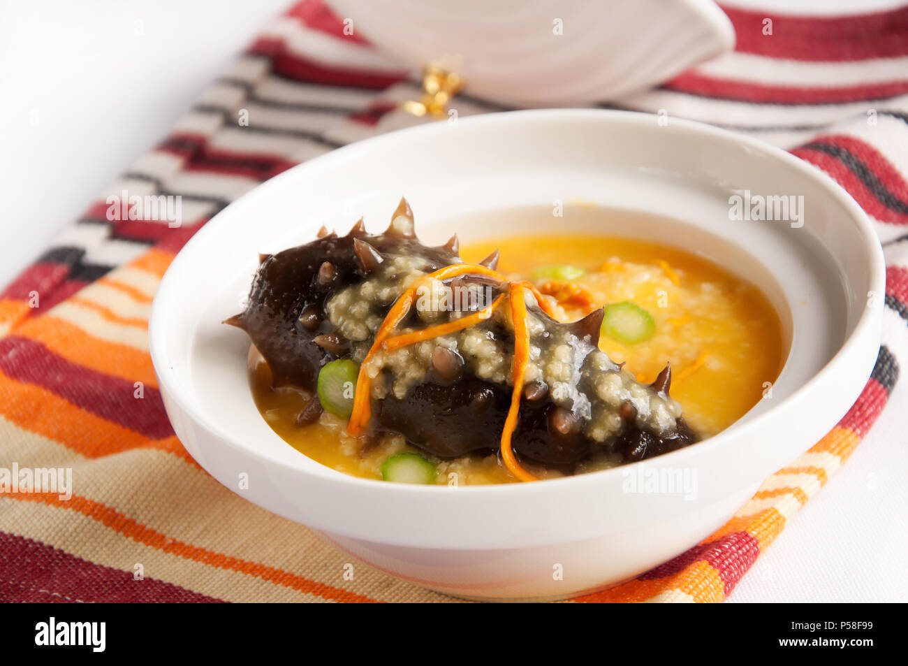 Chinese cuisineMillet with sea cucumber Stock Photo Alamy