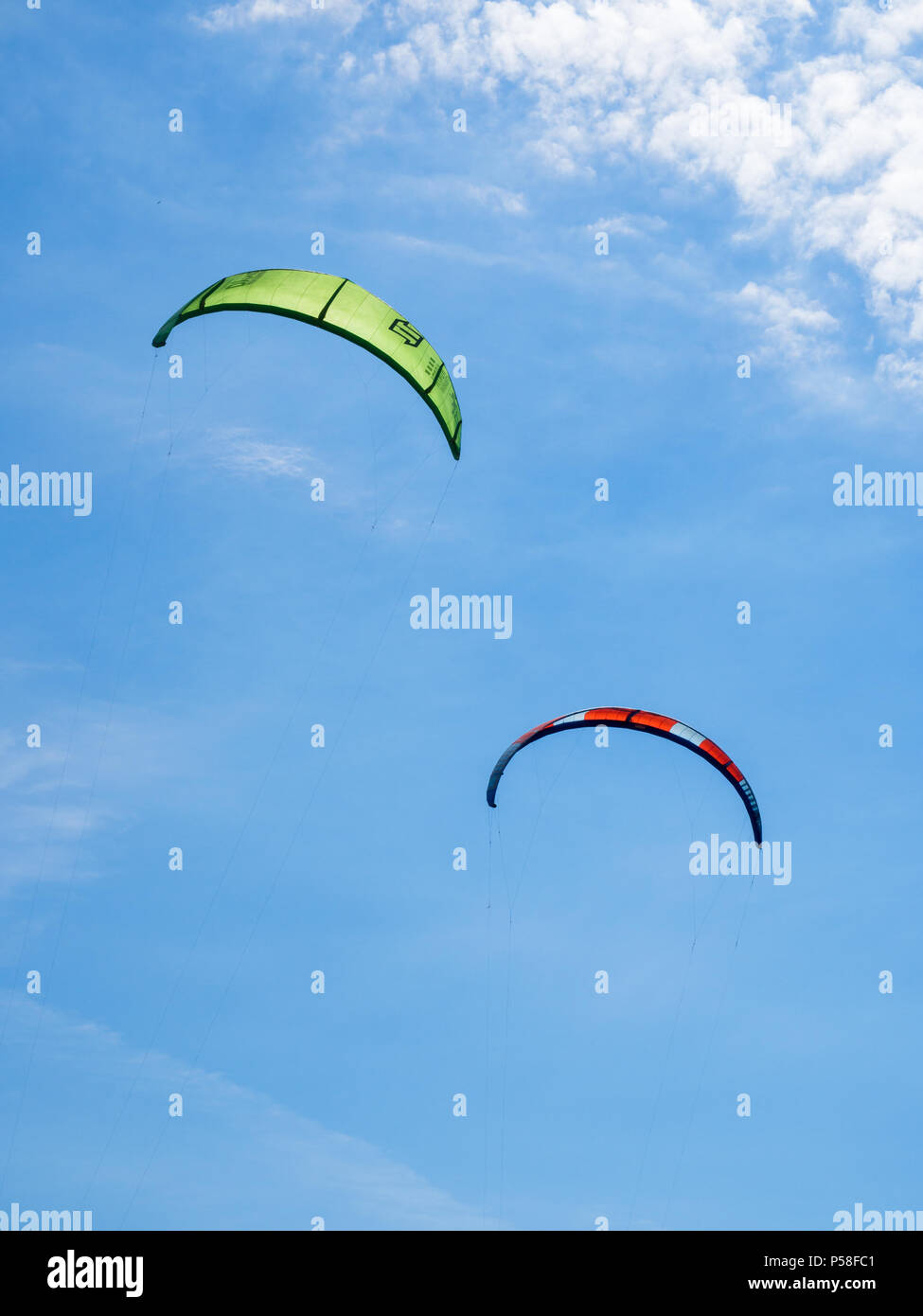 Two kite surf sails in the blue sky. Stock Photo