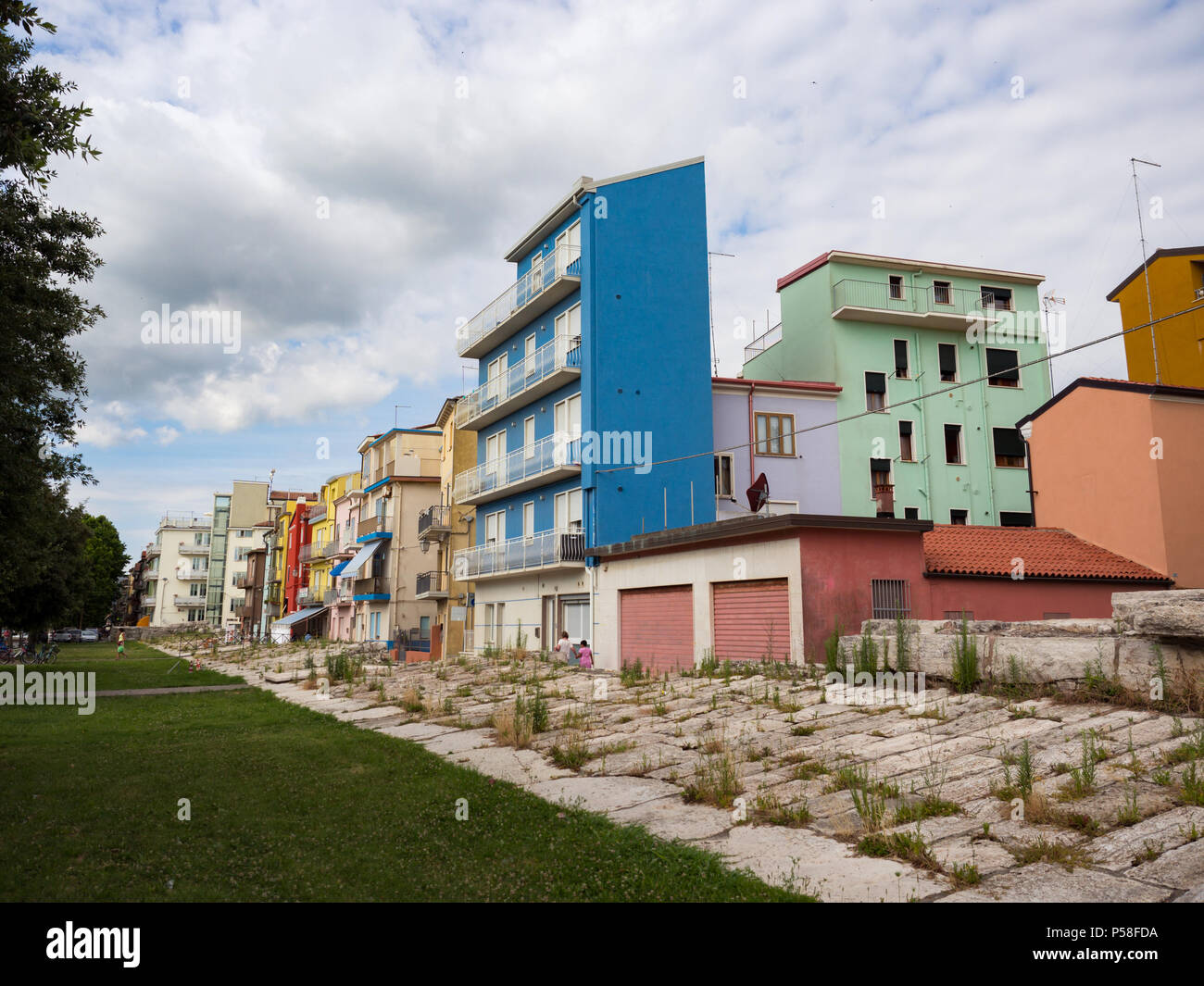 Typical houses in Sottomarina (Italy) with the embankment that protects them from sea storms. Stock Photo
