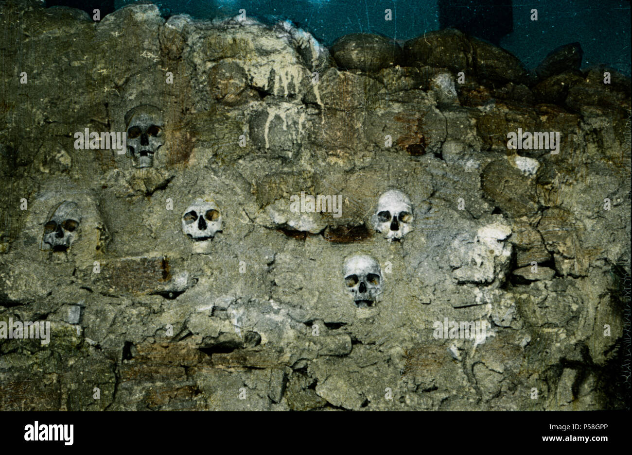 Skulls in Wall, Hand-Colored Magic Lantern Slide, 1920 Stock Photo