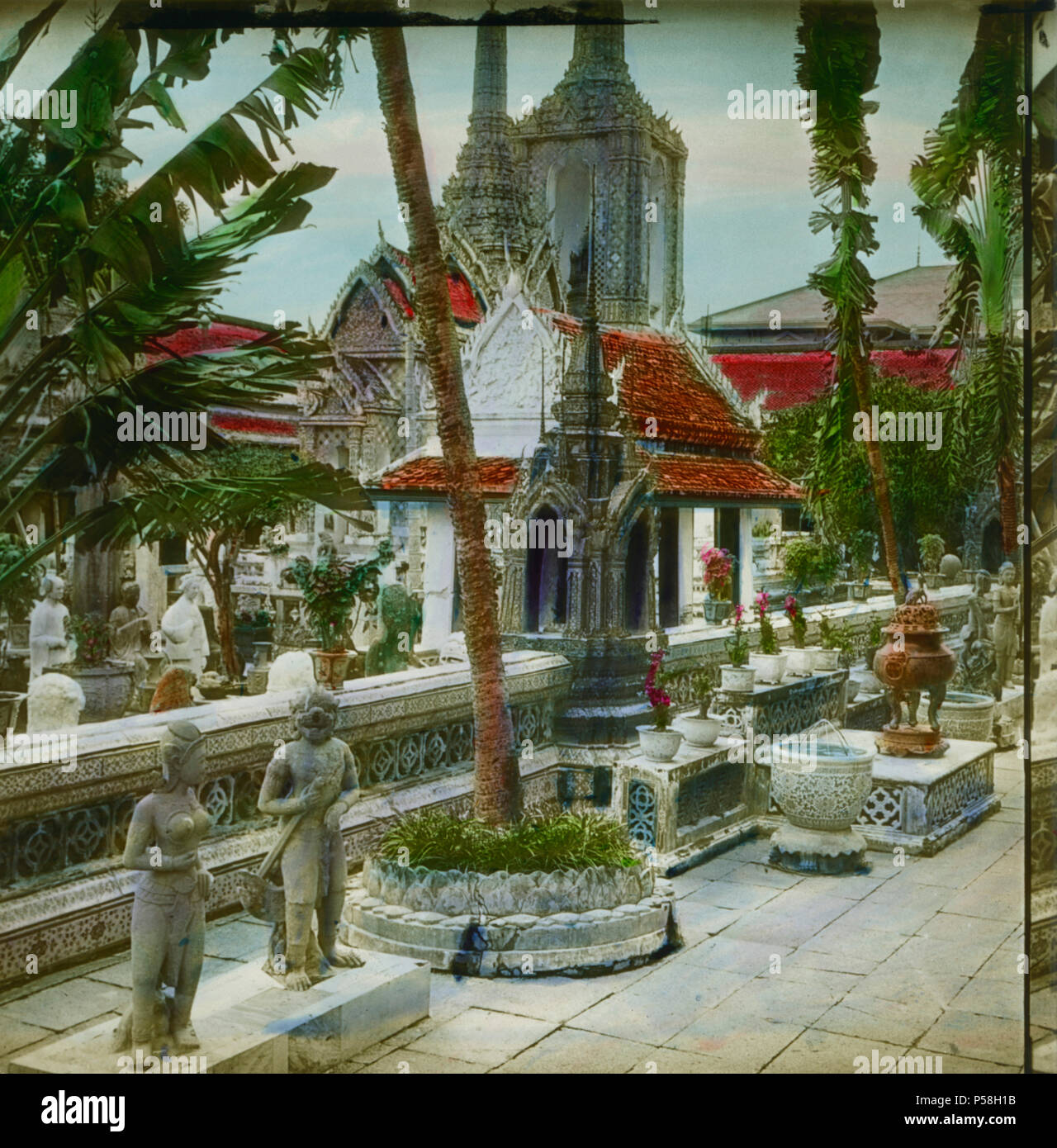 Wat Phra Kaew, Temple of the Emerald Buddha, Wat Phra Si Rattana Satsadaram, Bangkok, Thailand, Hand-Colored Magic Lantern Slide, Newton & Company, 1910 Stock Photo