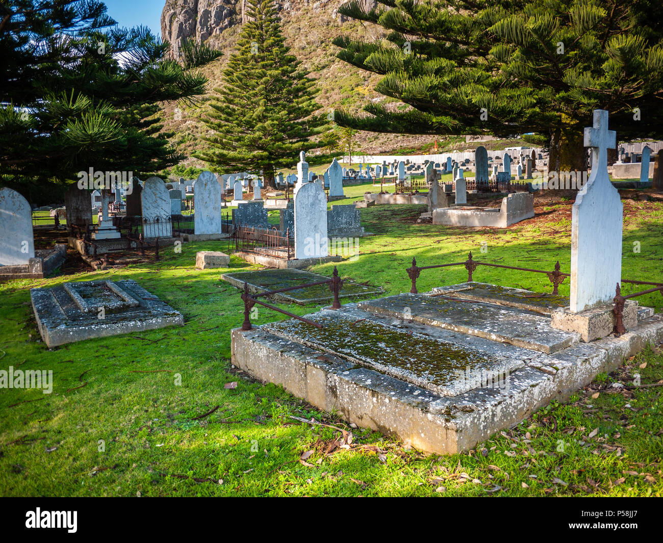 Tombstone and graves in graveyard. Old stone tombs in cemetery. Old Stanley Burial Ground, Town of Stanley, Tasmania, Australia Stock Photo