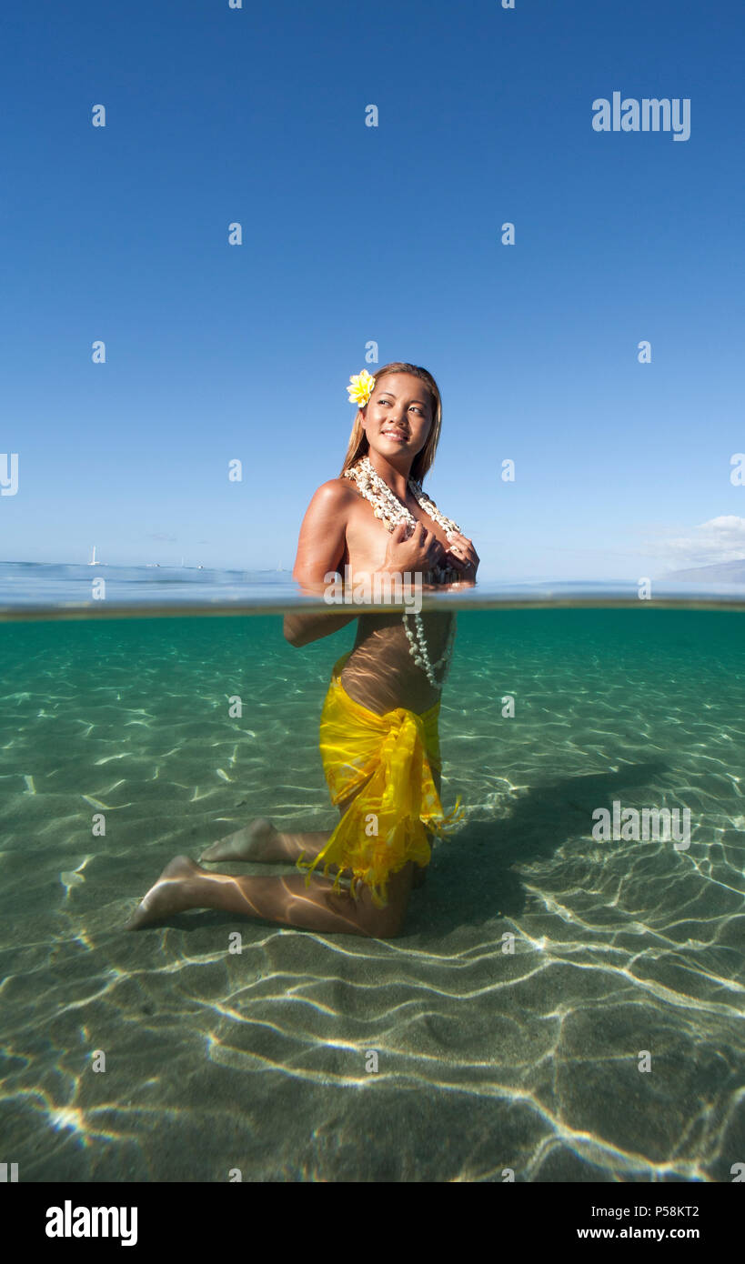 Over under view of attractive island girl, Lahaina, Maui, Hawaii Stock Photo