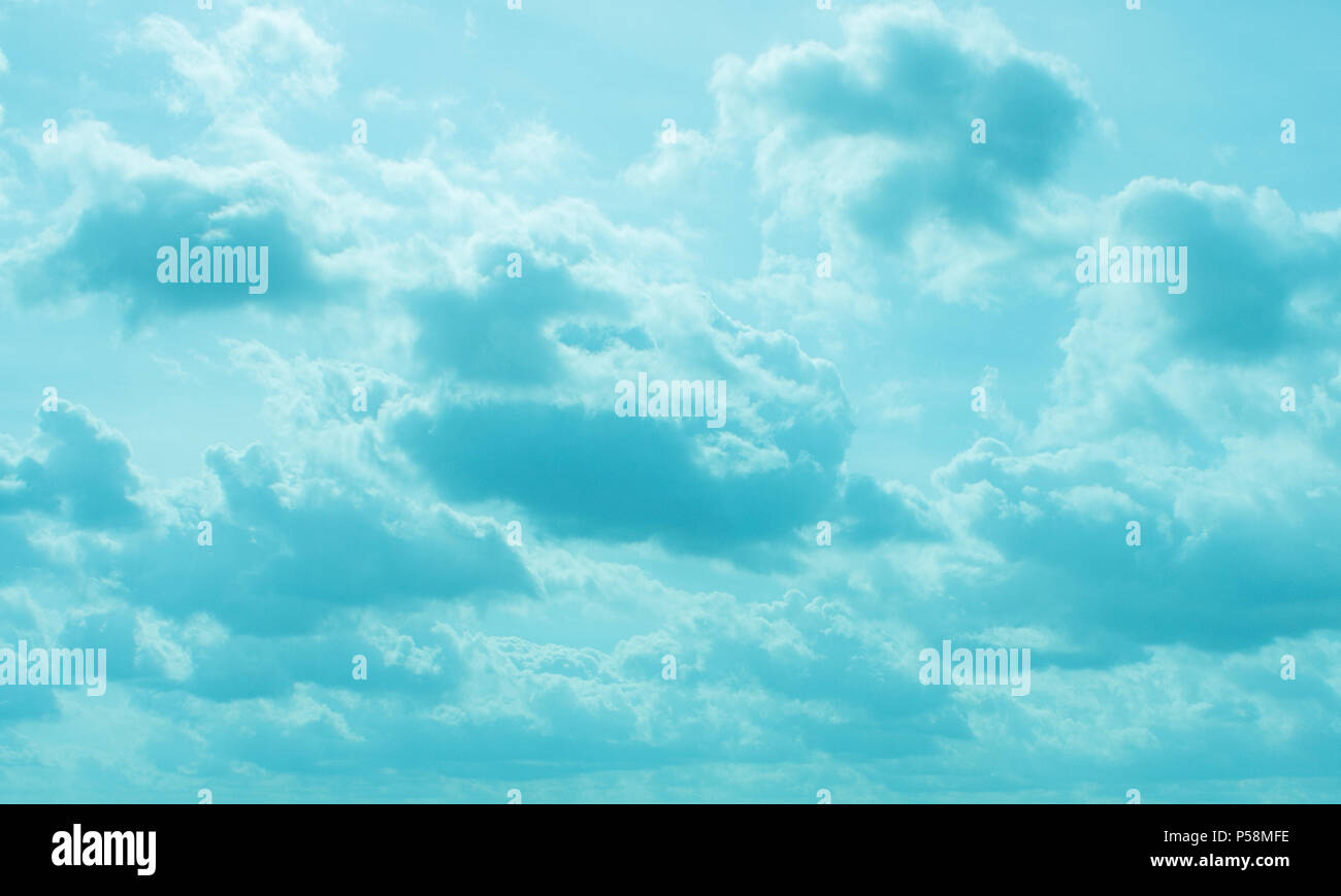 Despite dark clouds, on the blue sky  sun shines. Stock Photo