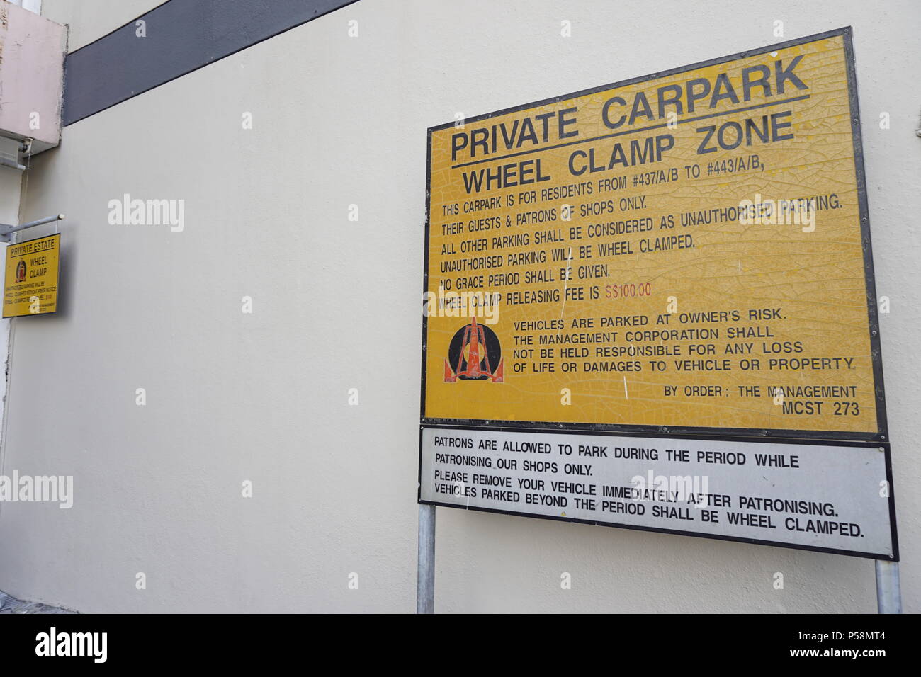 private carpark wheel clamp zone signboard in Singapore Stock Photo Alamy