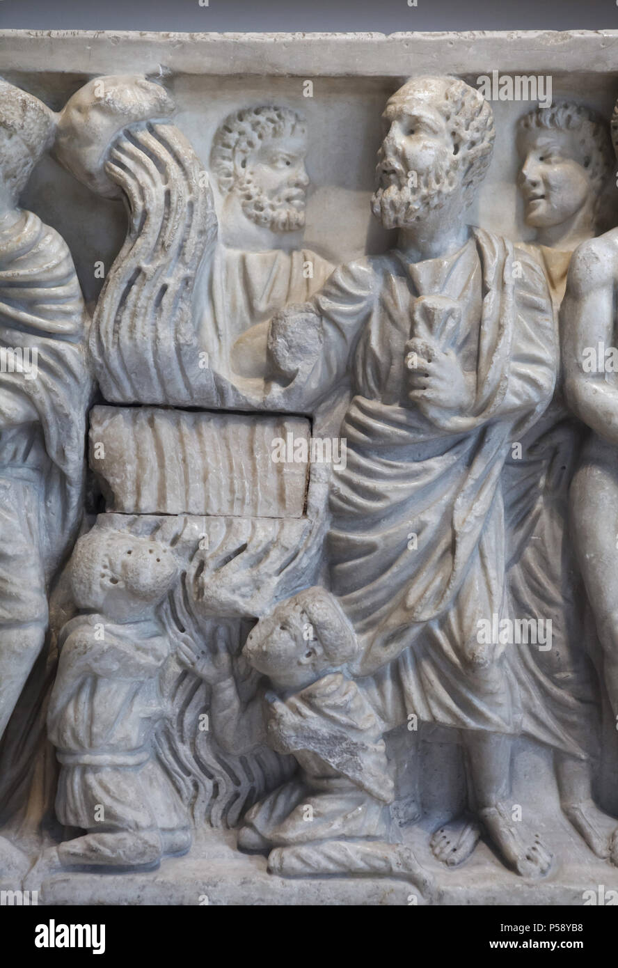 Miracle of the spring. Detail of the Roman marble sarcophagus dated from circa 310 AD from the Astorga Cathedral in León Province on display in the National Archaeological Museum (Museo Arqueológico Nacional) in Madrid, Spain. The Miracle of the spring is a story from the life of Saint Peter when in prison he causes water to well up so that he can baptize two soldiers. Stock Photo