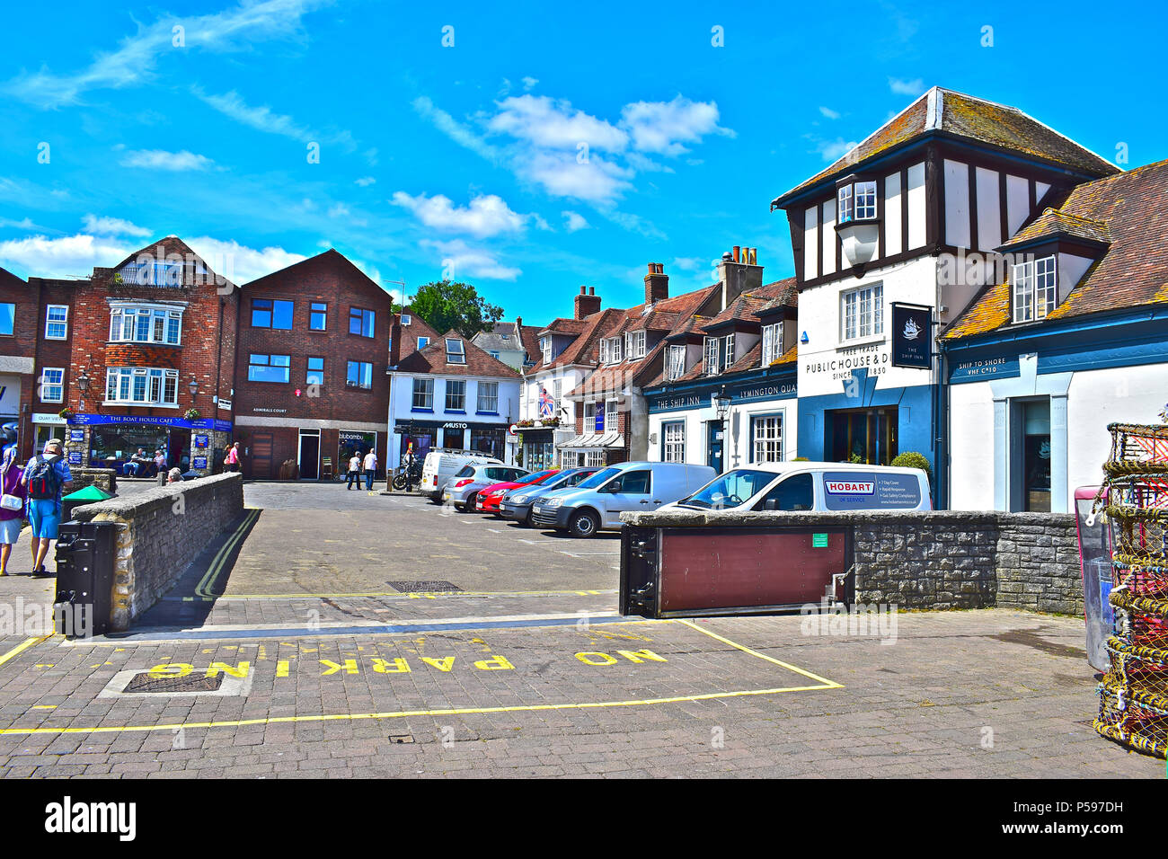 A collection of attractive buildings overlooking the slipway of the pretty harbour at Lymington, Hampshire Stock Photo