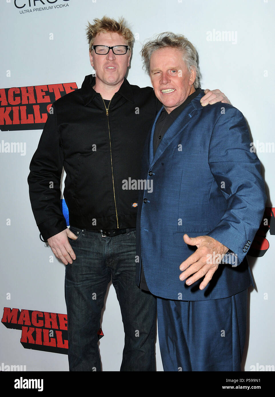 Jake And Dad Gary Busy Arriving At The Machete Kills Premiere At The Regal Theatre In Los Angeles Jake And Dad Gary Busy 117 Red Carpet Event Vertical Usa Film Industry Celebrities