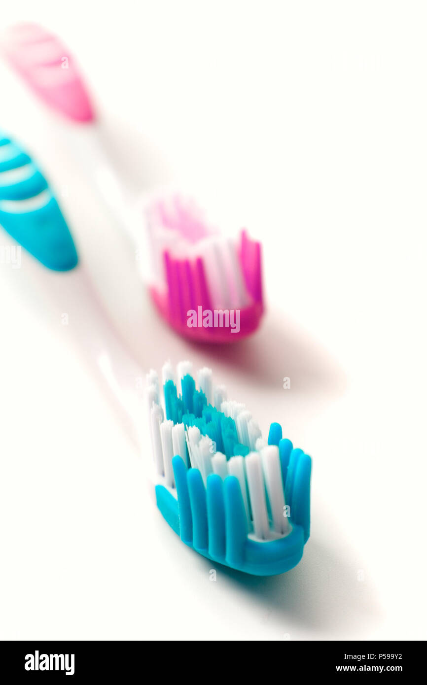 two toothbrushes on white background Stock Photo - Alamy
