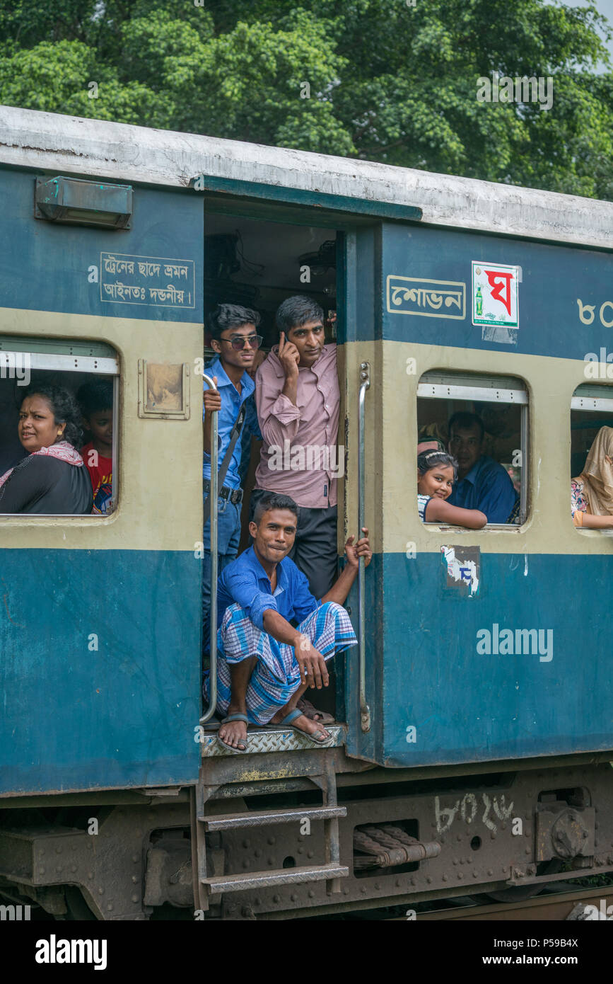 Commuters riding an inter city train in Dhaka, Bangladesh Stock Photo