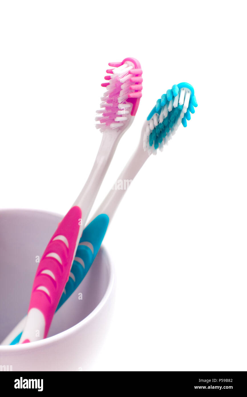 two toothbrushes on white background Stock Photo - Alamy