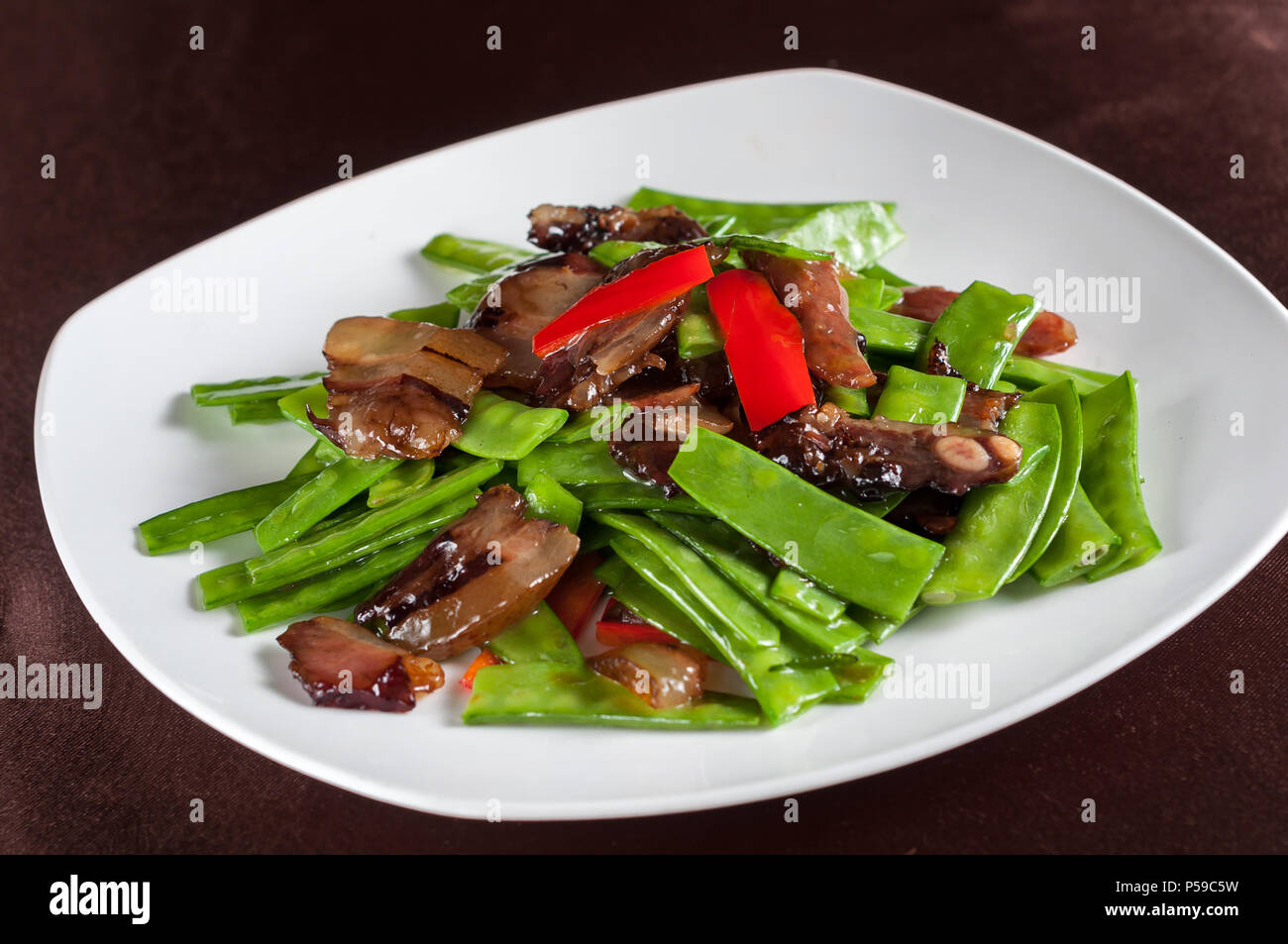 stirfried smoked pork with beans Stock Photo Alamy