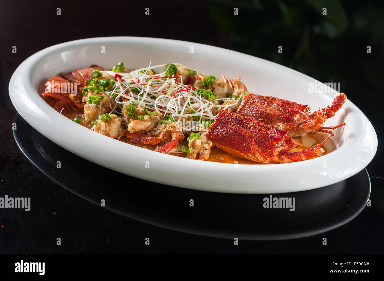 Steamed lobster with rice noodles and garlic Stock Photo Alamy