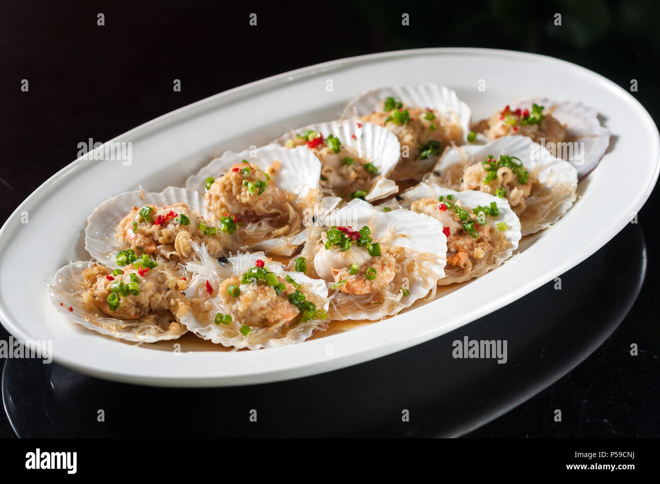 Steamed scallop with garlic and rice noodles Stock Photo Alamy