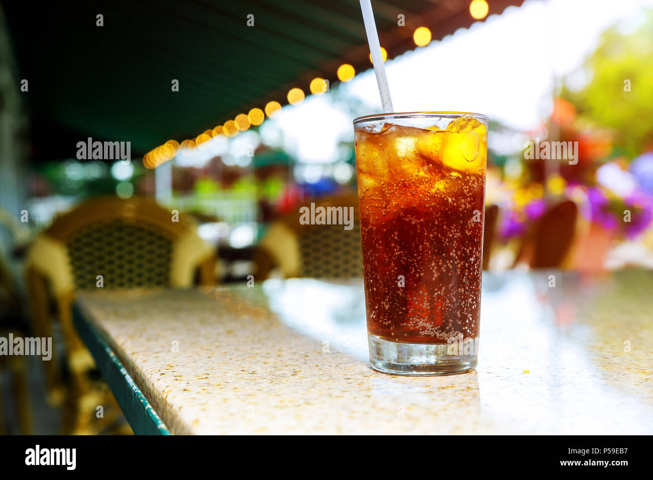 Ice Cold Cola With Drinks A Lemon On Cocktails An Outdoor Patio