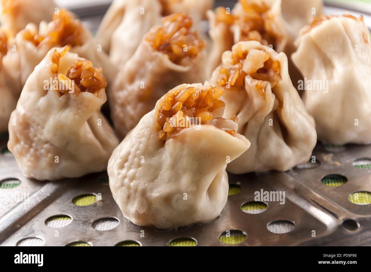 Siu Mai  - Chinese steamed pork dumplings in sauce. Stock Photo
