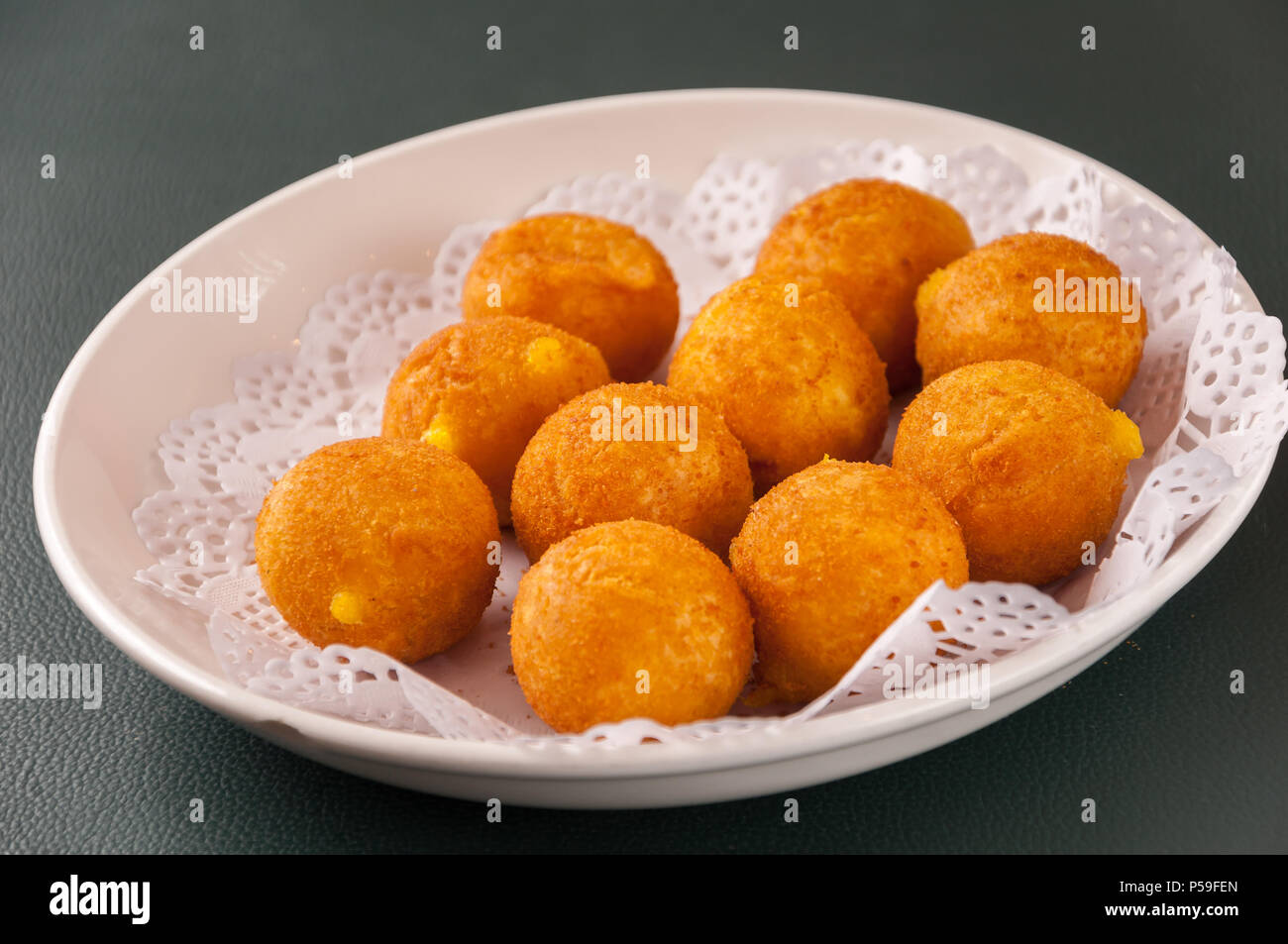 Khanom kai nok krata or deep-fried sweet potato balls Stock Photo - Alamy