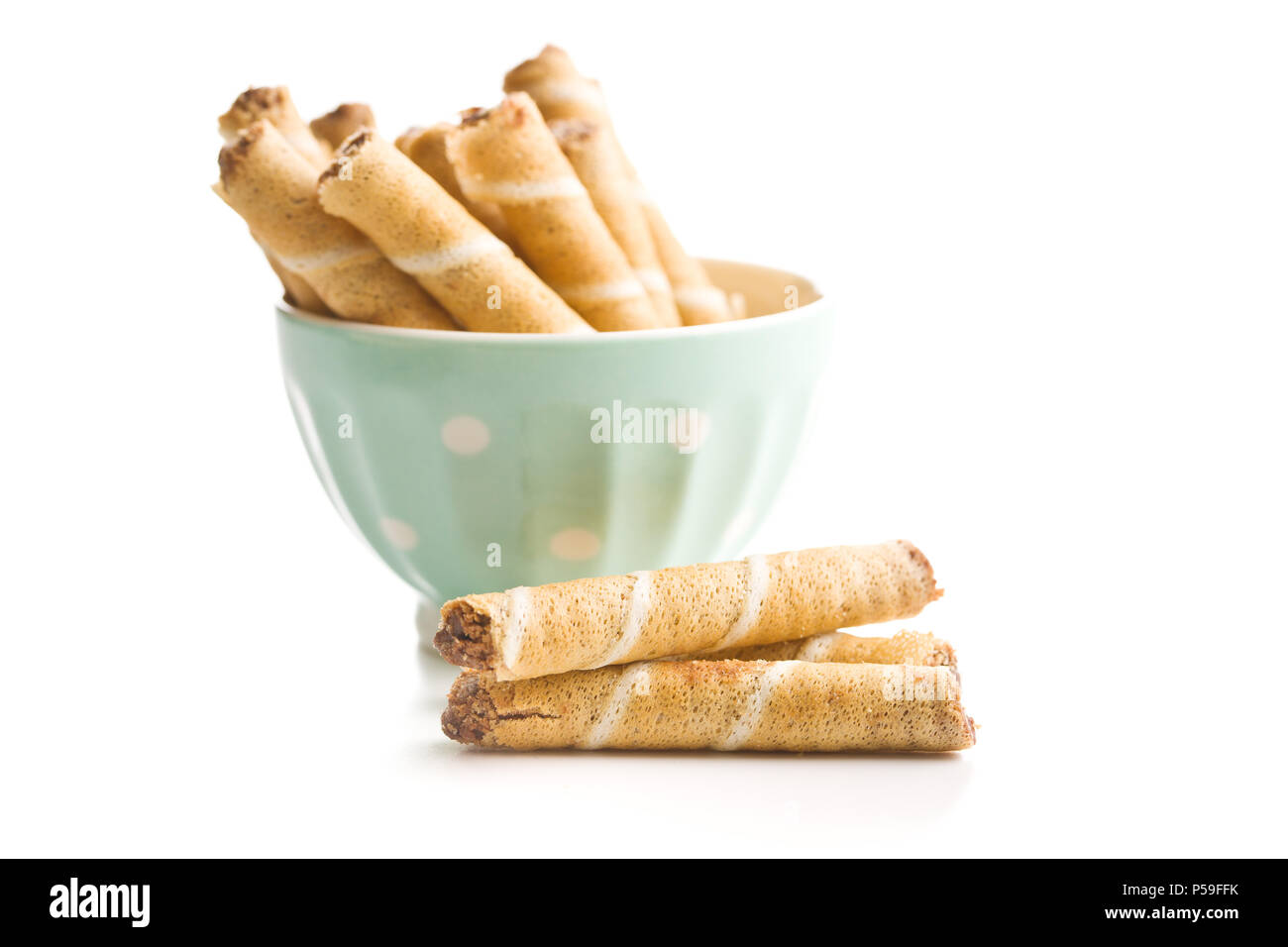 Sweet chocolate waffle rolls isolated on white background. Stock Photo