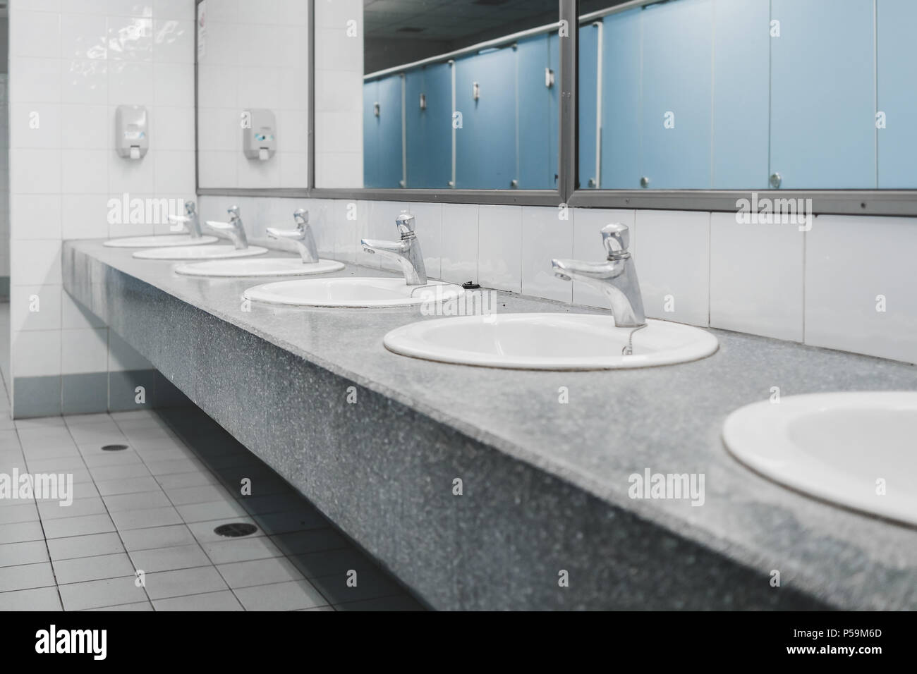 Public toilet and Bathroom interior with white wash basin and sink or lavatory, Closeup of the
