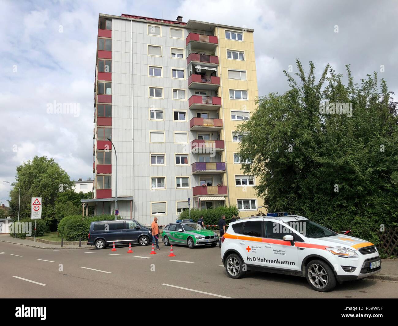 26 June 2018, Gunzenhausen, Germany: Police forces stand at the crime scene where four corpses as well as an injured man were found this morning. A domestic dispute has left a mother and her three children, ages three, seven and nine dead. A man was found heavily injured. Photo: Catherine Simon/dpa Stock Photo