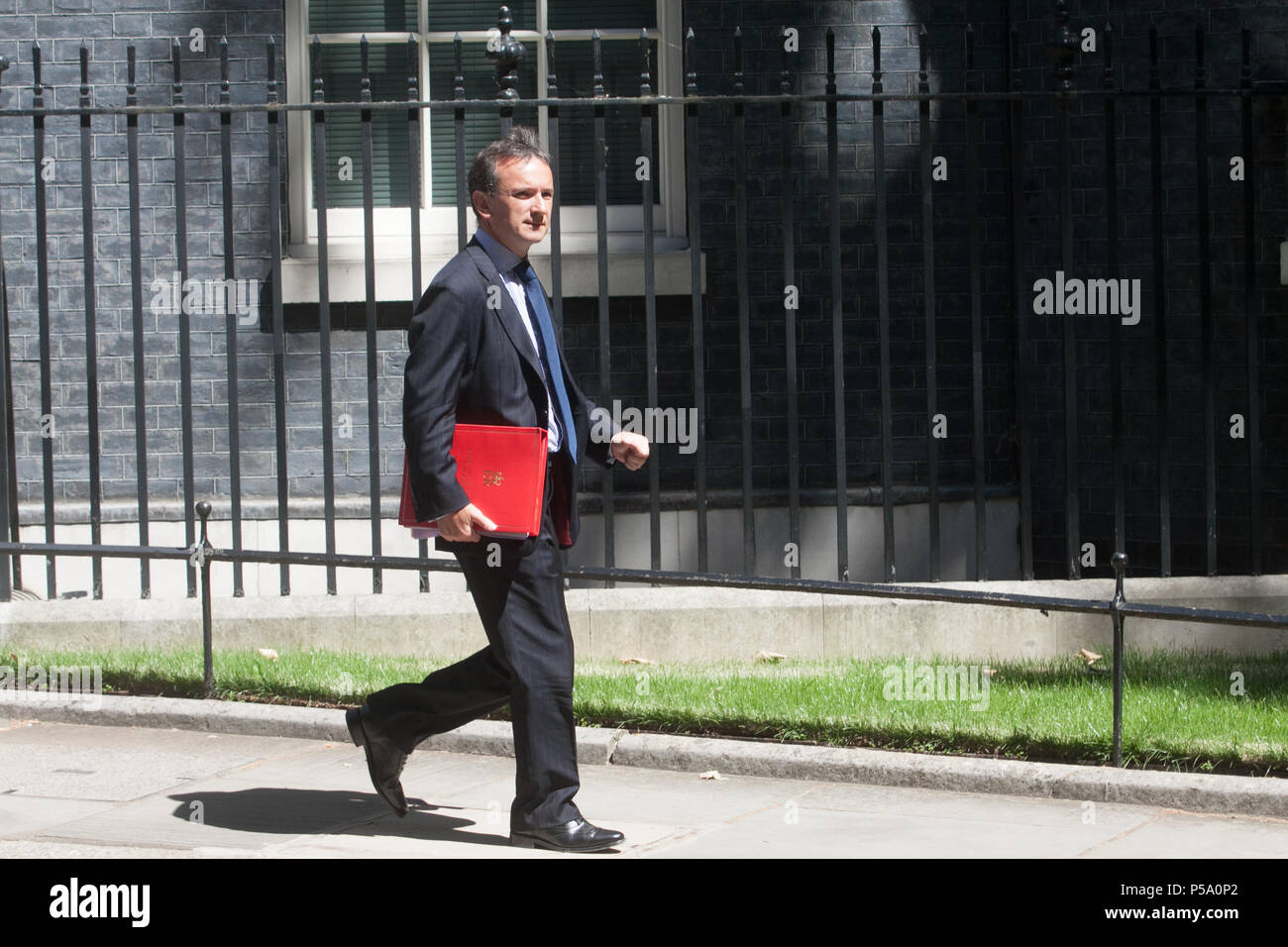 London. 26th June 2018. Secretary of State for Wales Alun Cairns MP leaves Downing Street aftwer the weekly cabinet meeting   leaves Downing Street after the weekly cabinet meeting Credit: amer ghazzal/Alamy Live News Stock Photo