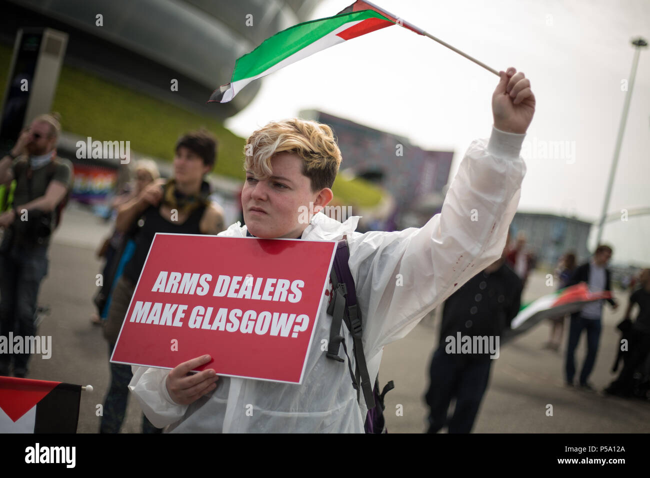 Glasgow, Scotland, on 26 June 2018. Glasgow Against The Arms Fair demonstration takes place outside the Undersea Defence Technology conference at the Scottish Exhibition Centre. The conference attracts 1,1000 delegates from around the world, and lead sponsors fair's lead sponsors, BAE Systems and Babcock International, have links to the Trident nuclear missile system. The Glasgow City Council has received criticism for appearing to initially support the arms fair. Image Credit: Jeremy Sutton-Hibbert/ Alamy Live News. Stock Photo