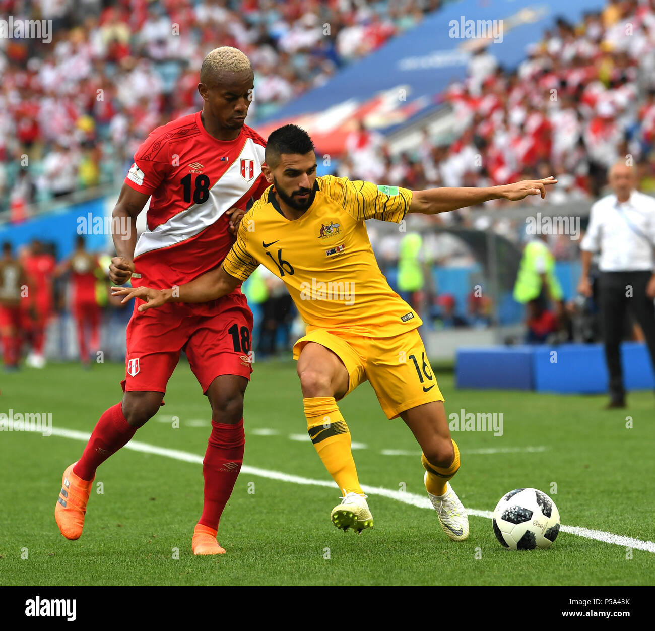 Sochi, Russia. 26th June, 2018. Aziz Behich (R) of Australia vies with Andre Carrillo of Peru during the 2018 FIFA World Cup Group C match between Australia and Peru in Sochi, Russia, June 26, 2018. Credit: Chen Cheng/Xinhua/Alamy Live News Stock Photo