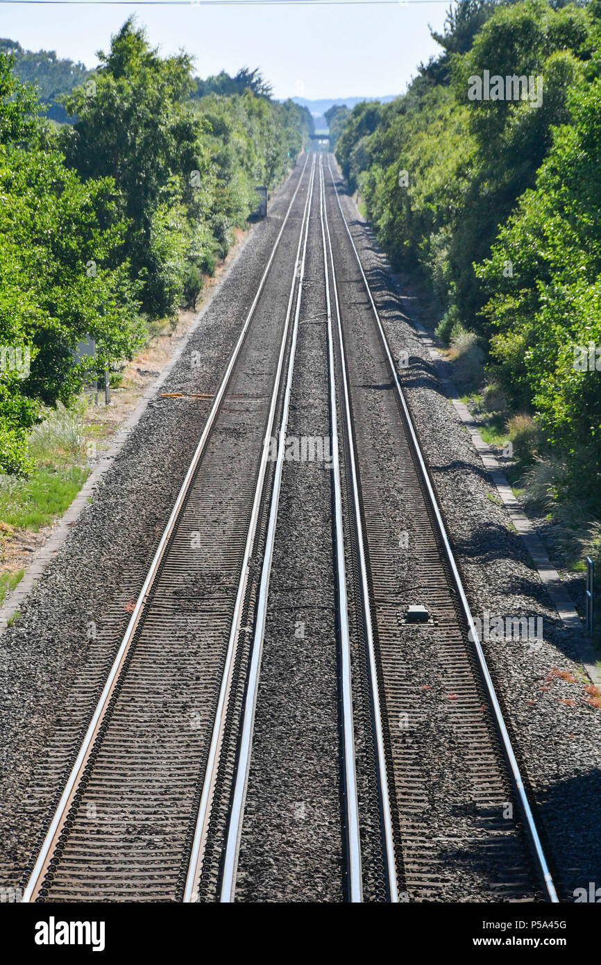 Holton Heath Station, Dorset, UK.  26th June 2018. UK Weather.   Delays on South Western Railways in Dorset after a small fire under a train between Surbiton and Weybridge blocked the West bound line.  This incident is on top of the speed restrictions on the railways due to the risk of the lines buckling due to the hot temperatures from the current heatwave.  Picture Credit: Graham Hunt/Alamy Live News Stock Photo