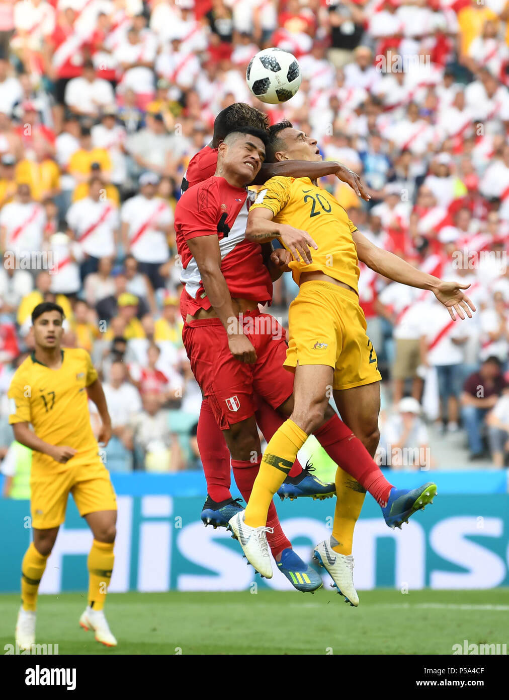 Sochi, Russia. 26th June, 2018. Trent Sainsbury (R) of Australia vies with Anderson Santamaria (C) of Peru during the 2018 FIFA World Cup Group C match between Australia and Peru in Sochi, Russia, June 26, 2018. Credit: Chen Cheng/Xinhua/Alamy Live News Stock Photo