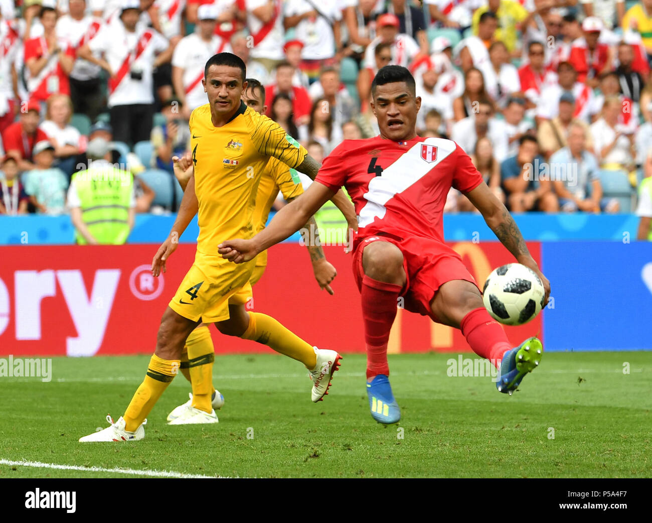 Sochi, Russia. 26th June, 2018. Tim Cahill (L) of Australia vies with Anderson Santamaria of Peru during the 2018 FIFA World Cup Group C match between Australia and Peru in Sochi, Russia, June 26, 2018. Credit: Chen Cheng/Xinhua/Alamy Live News Stock Photo