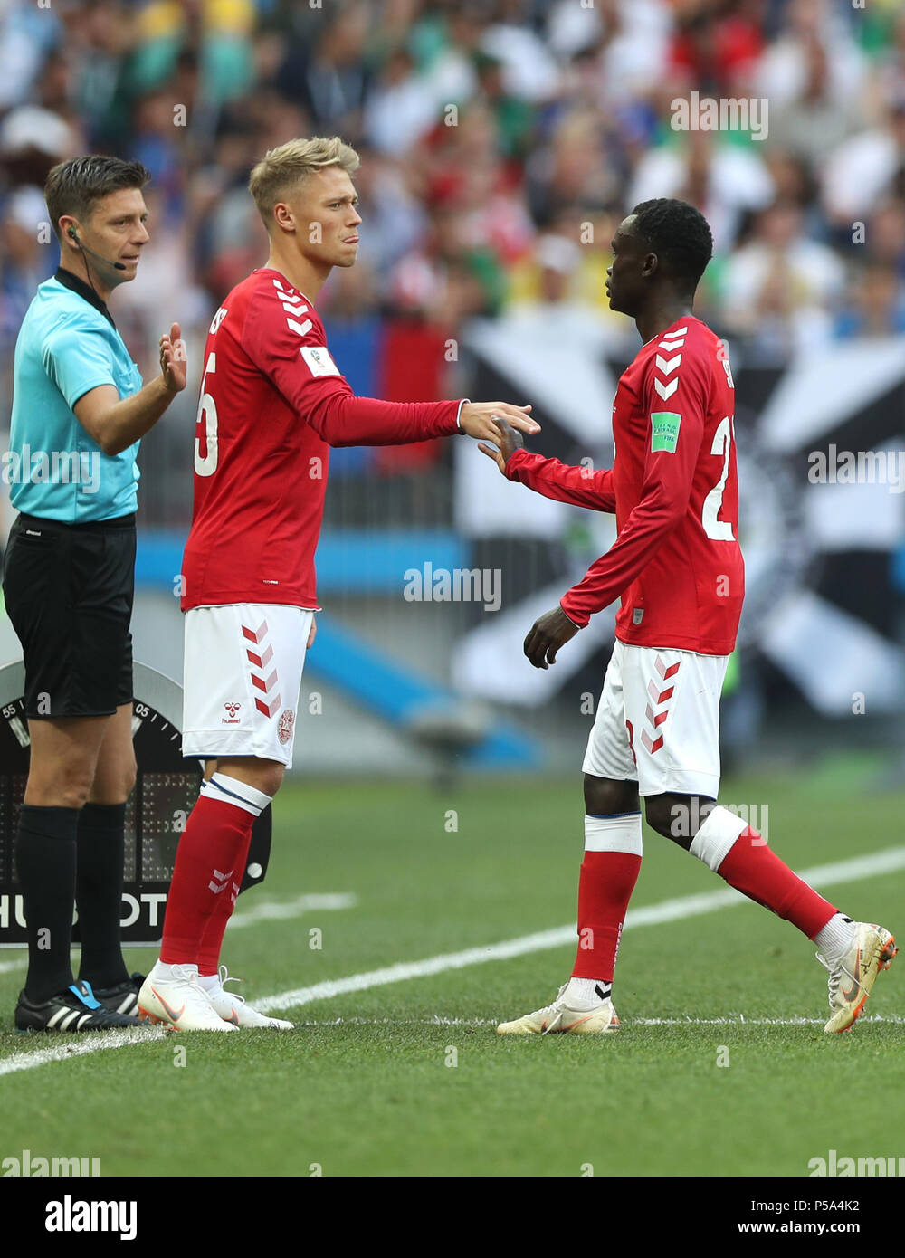Moscow, Russia. 26th June, 2018. Denmark's Pione Sisto (R) leaves the pitch after being substituted off by Viktor Fischer during the 2018 FIFA World Cup Group C match between Denmark and France in Moscow, Russia, June 26, 2018. Credit: Xu Zijian/Xinhua/Alamy Live News Stock Photo