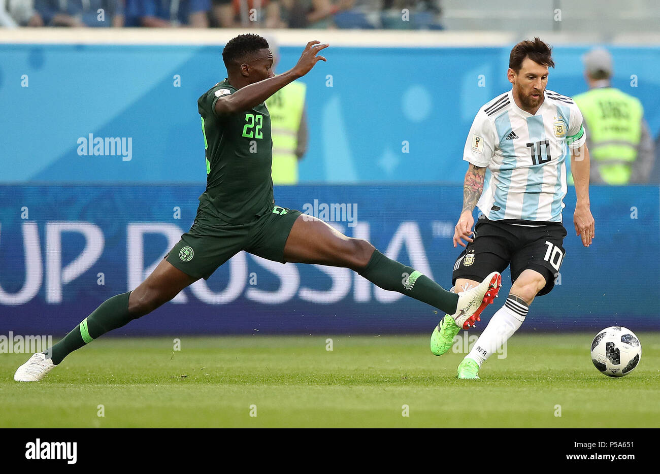 Saint Petersburg, Russia. 26th June, 2018. Lionel Messi (R) of Argentina vies with Kenneth Omeruo of Nigeria during the 2018 FIFA World Cup Group D match between Nigeria and Argentina in Saint Petersburg, Russia, June 26, 2018. Credit: Wu Zhuang/Xinhua/Alamy Live News Stock Photo