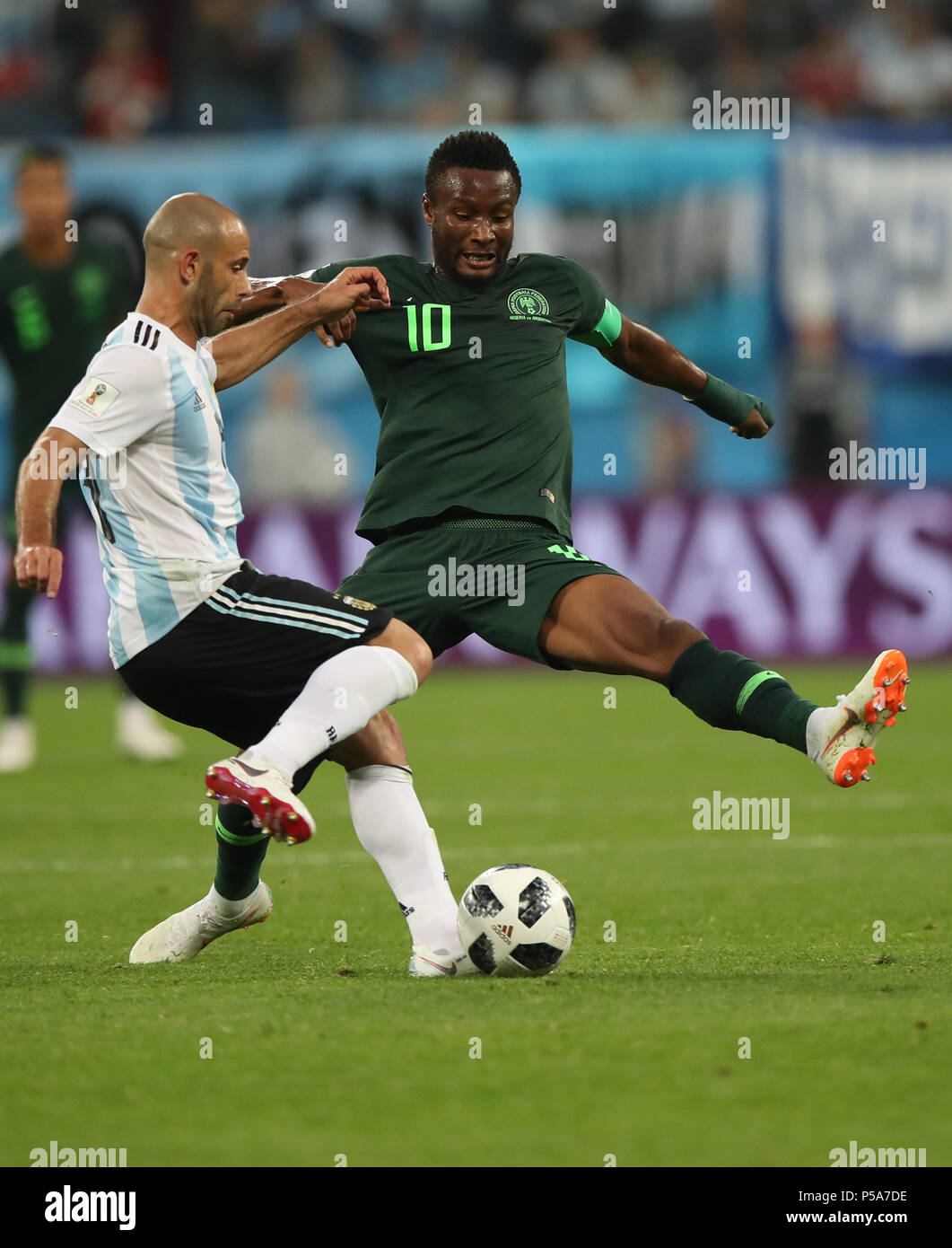 Saint Petersburg, Russia. 26th June, 2018. John Obi Mikel (R) of Nigeria vies with Javier Mascherano of Argentina during the 2018 FIFA World Cup Group D match between Nigeria and Argentina in Saint Petersburg, Russia, June 26, 2018. Credit: Wu Zhuang/Xinhua/Alamy Live News Stock Photo