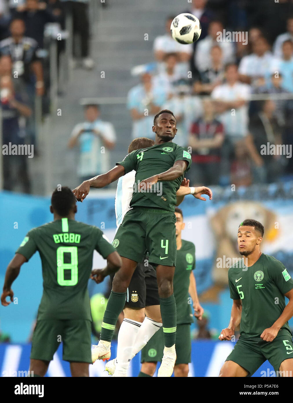 Saint Petersburg, Russia. 26th June, 2018. Wilfred Ndidi (top) of Nigeria competes for a header during the 2018 FIFA World Cup Group D match between Nigeria and Argentina in Saint Petersburg, Russia, June 26, 2018. Credit: Wu Zhuang/Xinhua/Alamy Live News Stock Photo