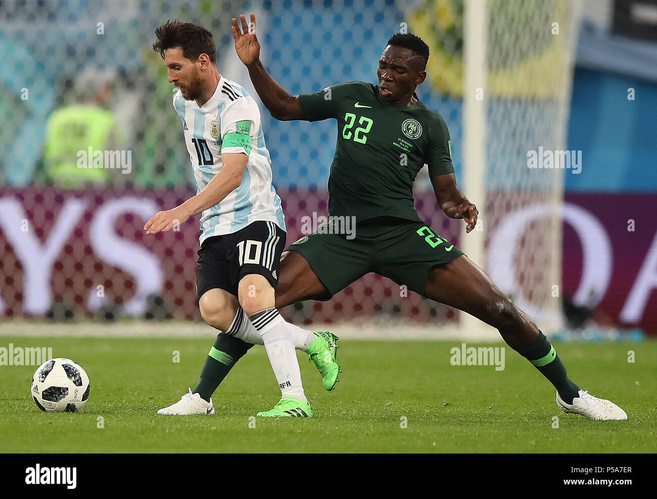 Saint Petersburg, Russia. 26th June, 2018. Lionel Messi (L) of Argentina vies with Kenneth Omeruo of Nigeria during the 2018 FIFA World Cup Group D match between Nigeria and Argentina in Saint Petersburg, Russia, June 26, 2018. Credit: Wu Zhuang/Xinhua/Alamy Live News Stock Photo