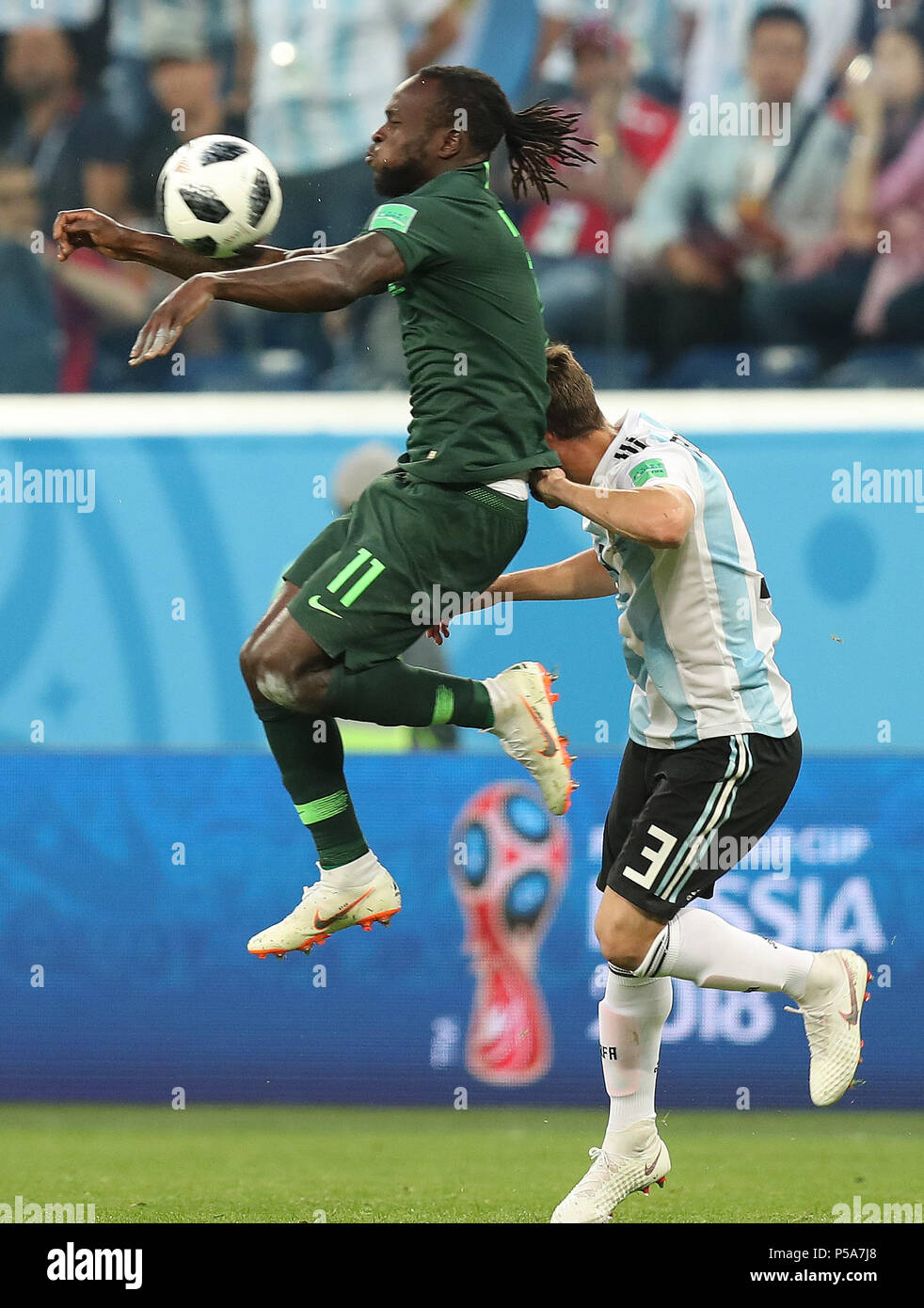 Saint Petersburg, Russia. 26th June, 2018. Victor Moses (top) of Nigeria vies with Nicolas Tagliafico of Argentina during the 2018 FIFA World Cup Group D match between Nigeria and Argentina in Saint Petersburg, Russia, June 26, 2018. Credit: Yang Lei/Xinhua/Alamy Live News Stock Photo