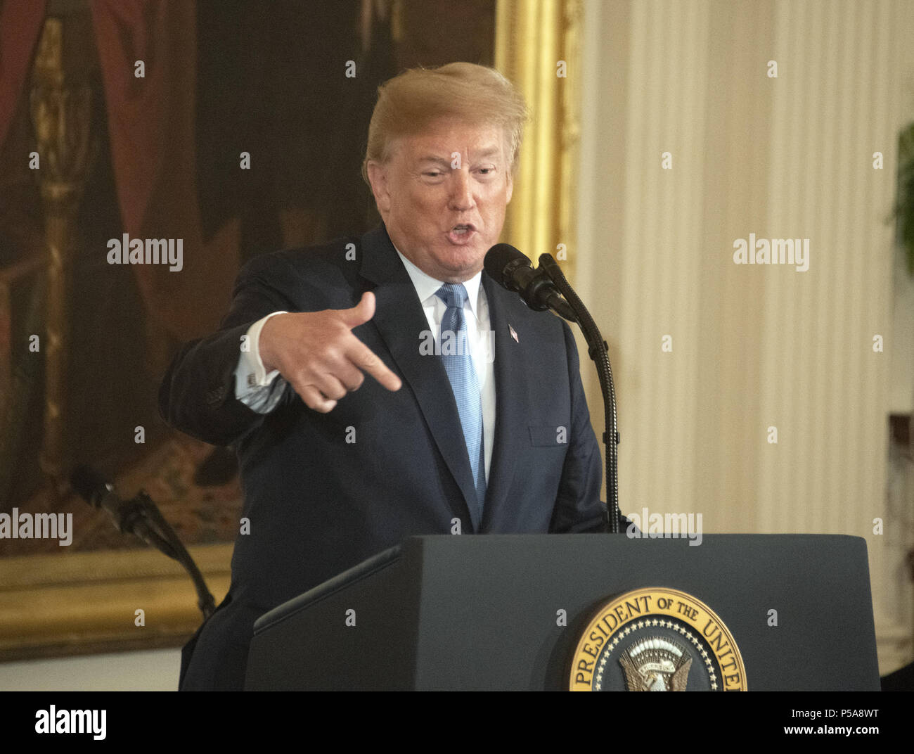 Washington DC, USA. 26th June, 2018. - United States President Donald J. Trump makes remarks as he hosts a ceremony to posthumously award the Medal of Honor to then-First Lieutenant Garlin M. Conner, U.S. Army, for conspicuous gallantry during World War II in the East Room of the White House in Washington, DC on Tuesday, June 26, 2018. Conner is being honored for his actions on January 24,1945, while serving as an intelligence officer with Headquarters and Headquarters Company, 3d Battalion, 7th Infantry Regiment, 3d Infantry Division. Credit: ZUMA Press, Inc./Alamy Live News Stock Photo